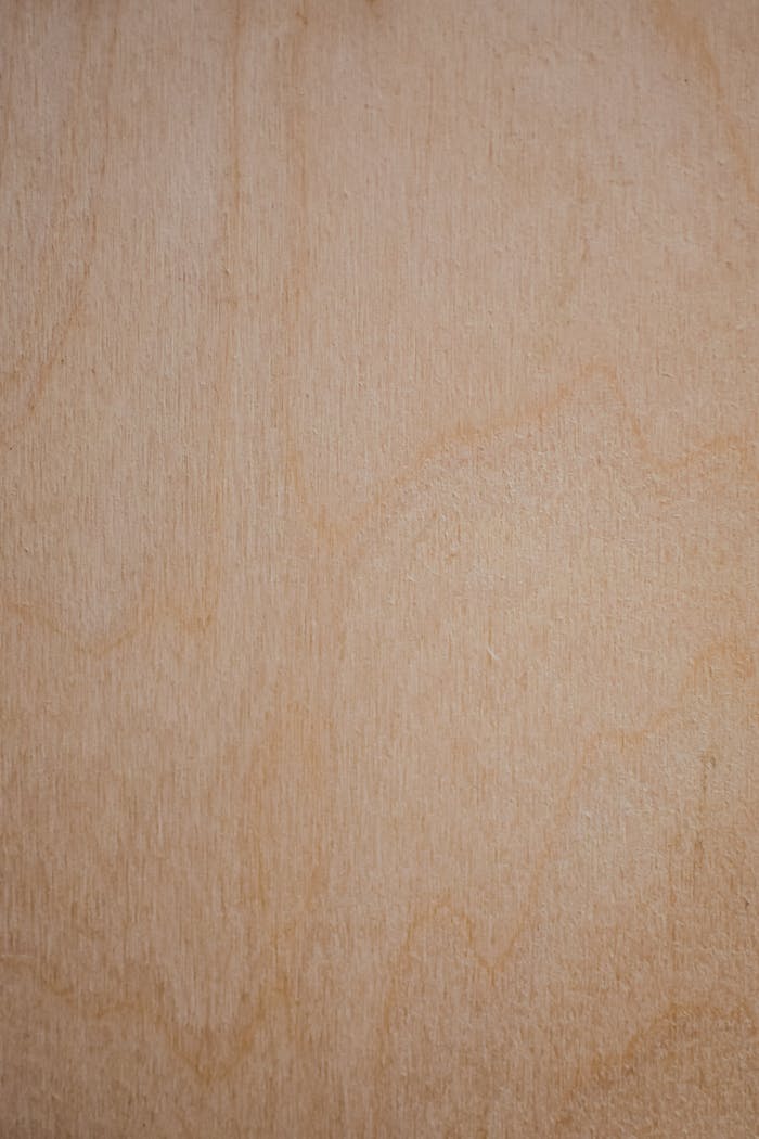 Close-up of a smooth wooden texture showing natural wood grain and patterns.