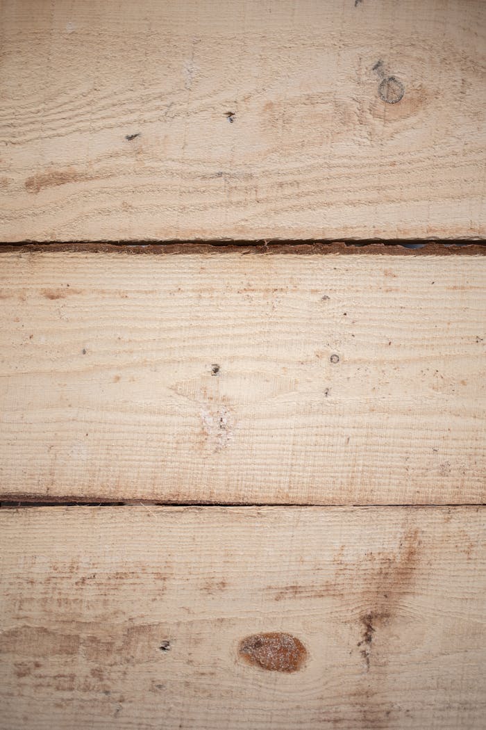 Detailed close-up image of natural wood planks showcasing texture and grain for backgrounds.